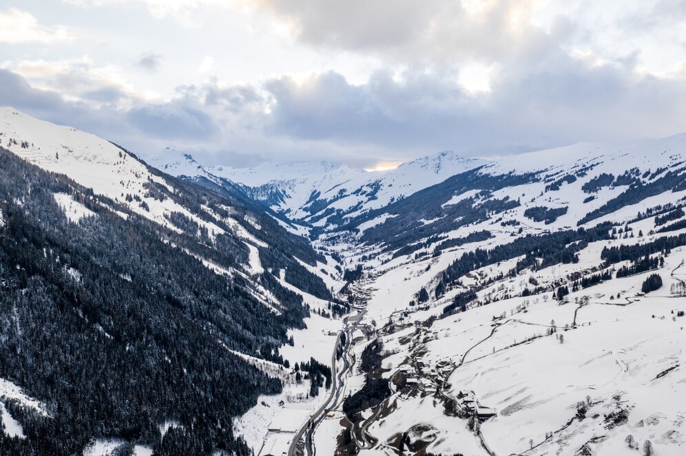 aerial-view-mountain-peaks-covered-with-snow-daytime_181624-37548