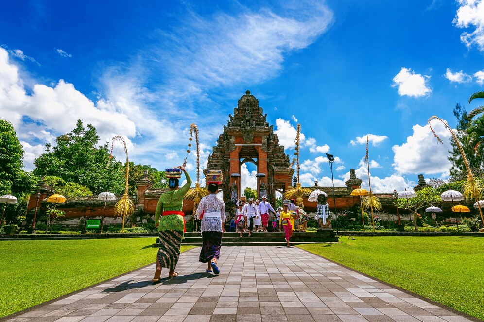 balinese-people-traditional-clothes-religious-ceremony-pura-taman-ayun-temple-bali-indonesia_335224-390